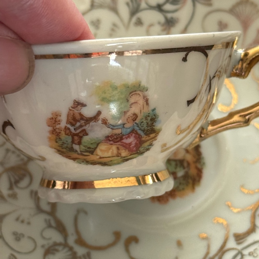 Elegant Gold and Cream Teacup with Artwork . Porcelain tea cup .